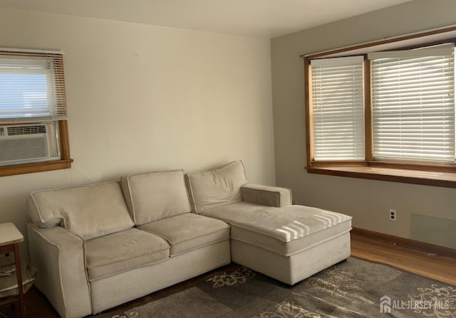 living room with dark hardwood / wood-style flooring and cooling unit