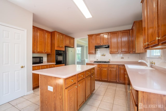 23 Heather Ct, Plainsboro, NJ 08536 - kitchen with black appliances, light tile patterned floors, light countertops, and a sink