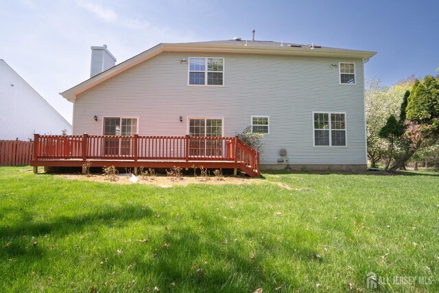 23 Heather Ct, Plainsboro, NJ 08536 - back of property featuring a chimney, a lawn, and a deck
