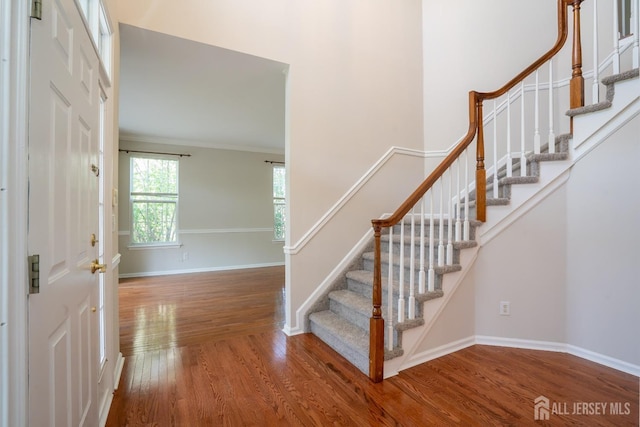 23 Heather Ct, Plainsboro, NJ 08536 - entryway with wood finished floors, stairs, baseboards, and ornamental molding