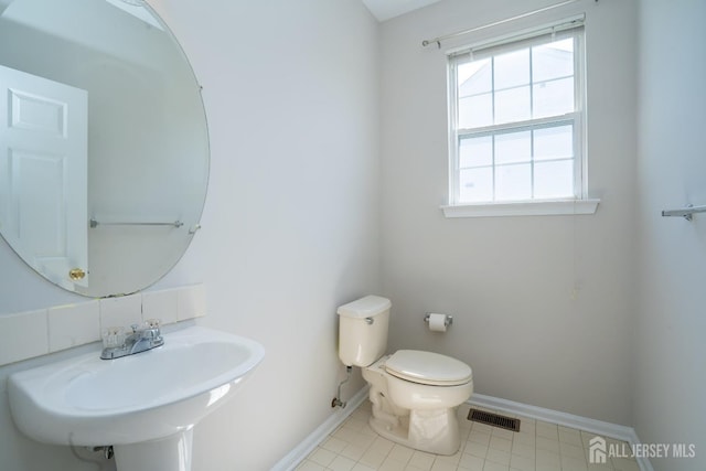23 Heather Ct, Plainsboro, NJ 08536 - half bathroom with a sink, baseboards, and toilet