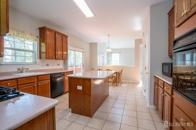 23 Heather Ct, Plainsboro, NJ 08536 - kitchen with black appliances, a sink, brown cabinetry, and plenty of natural light
