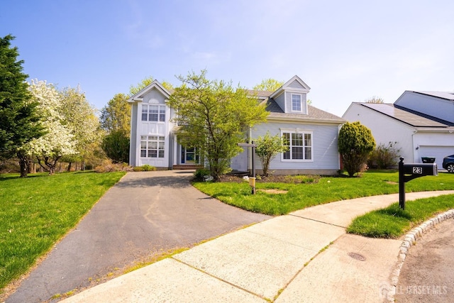 23 Heather Ct, Plainsboro, NJ 08536 - view of front of property with a front yard and asphalt driveway