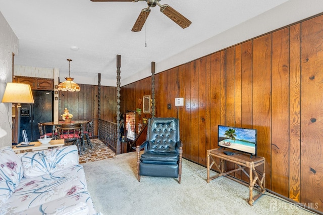 92 Maplewood Ave, Edison, NJ 08837 - living area with wood walls, a ceiling fan, and carpet