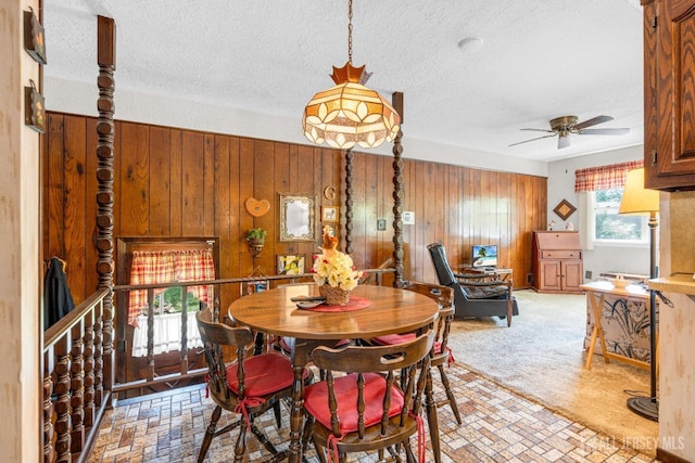 92 Maplewood Ave, Edison, NJ 08837 - dining space with ceiling fan, wood walls, and a textured ceiling