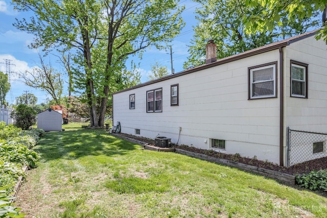 92 Maplewood Ave, Edison, NJ 08837 - view of side of property featuring a yard and a chimney