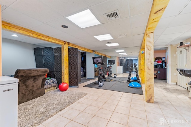 430 Wood Ave, North Brunswick, NJ 08902 - workout room with a paneled ceiling and tile patterned floors