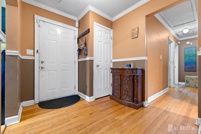 430 Wood Ave, North Brunswick, NJ 08902 - entrance foyer with light wood-style flooring and crown molding