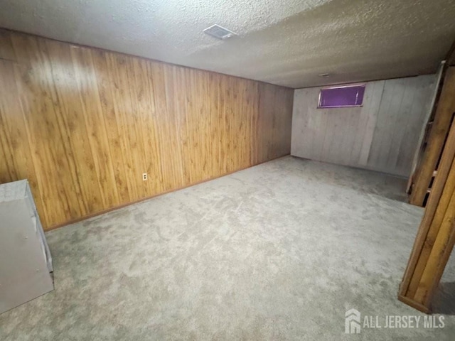 92 Beverly Hill Ter Unit D, Woodbridge Proper, NJ 07095 - finished basement featuring wood walls, carpet flooring, and a textured ceiling