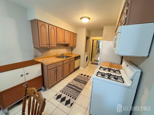 92 Beverly Hill Ter Unit D, Woodbridge Proper, NJ 07095 - kitchen featuring white appliances, washer / dryer, light countertops, and light tile patterned floors