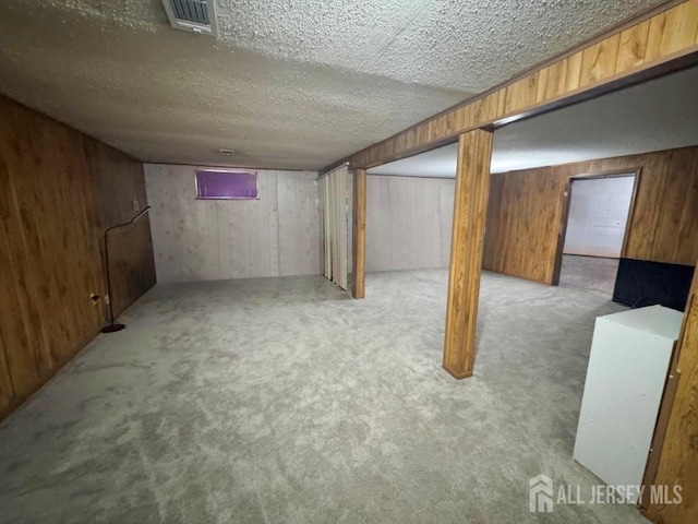 92 Beverly Hill Ter Unit D, Woodbridge Proper, NJ 07095 - finished below grade area with carpet, wood walls, and a textured ceiling