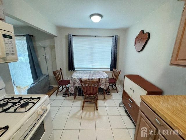 92 Beverly Hill Ter Unit D, Woodbridge Proper, NJ 07095 - dining area with healthy amount of natural light and light tile patterned flooring