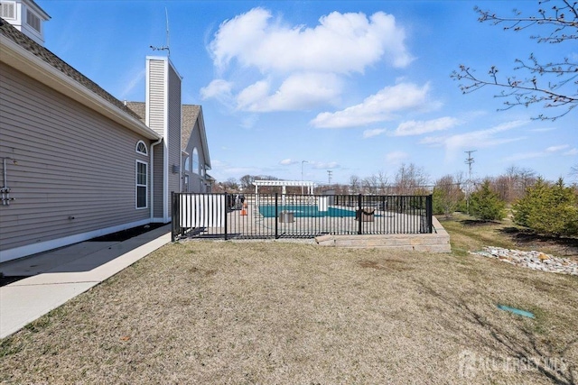 view of swimming pool with a fenced in pool and fence