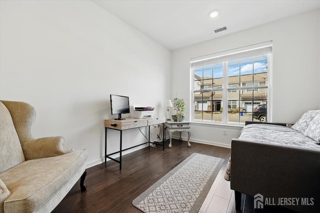 office space with recessed lighting, visible vents, baseboards, and wood finished floors