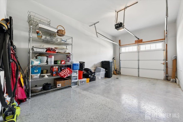 garage featuring a garage door opener