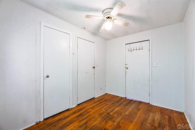 interior space featuring dark hardwood / wood-style flooring and ceiling fan