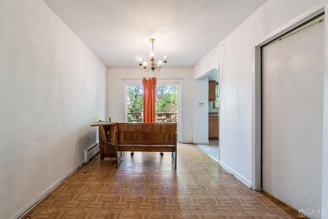 interior space with parquet floors, baseboard heating, and an inviting chandelier