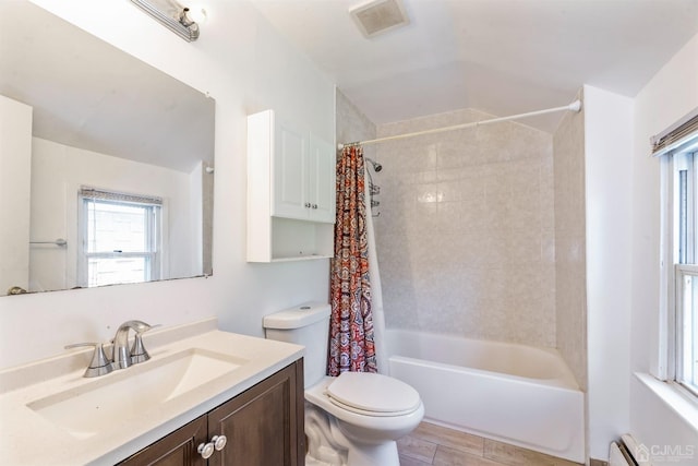 51 Delafield St, New Brunswick, NJ 08901 - full bathroom with vanity, toilet, shower / tub combo, a baseboard heating unit, and vaulted ceiling