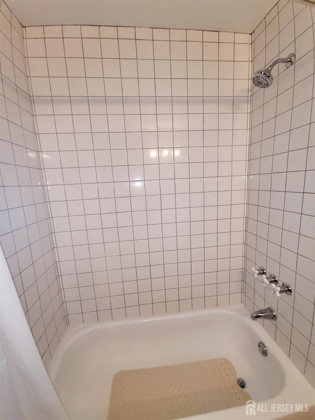 bathroom with shower / bath combination