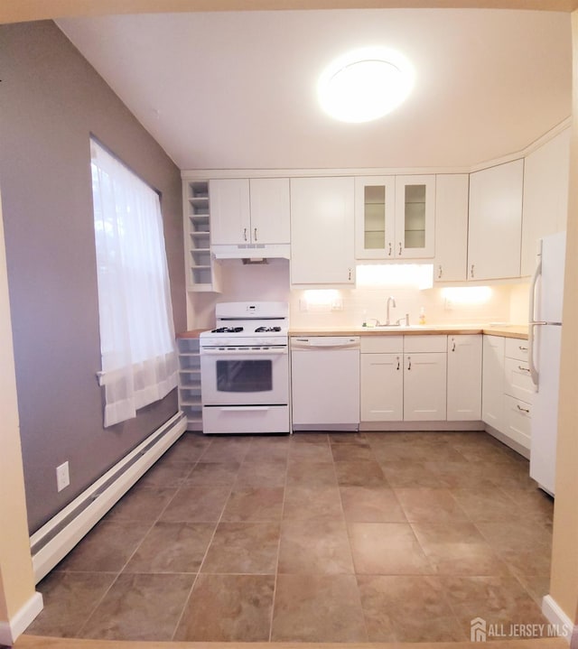 kitchen featuring white appliances, a sink, white cabinets, under cabinet range hood, and baseboard heating