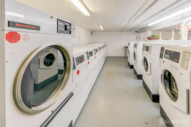 community laundry room featuring washer and clothes dryer