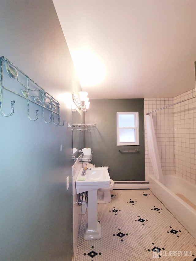 bathroom with tile patterned floors and shower / tub combo