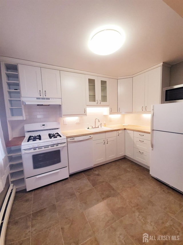 kitchen featuring under cabinet range hood, a sink, white cabinetry, white appliances, and a baseboard radiator