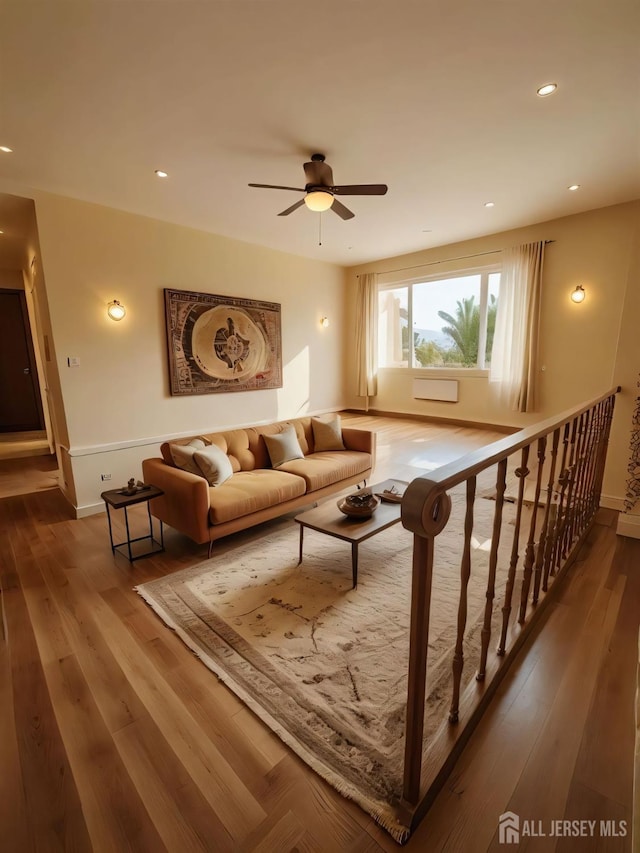 living room with recessed lighting, ceiling fan, baseboards, and hardwood / wood-style floors