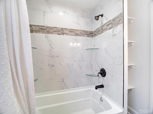 bathroom featuring shower / bath combo with shower curtain