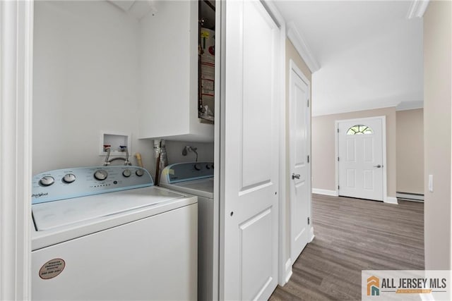 265 Crosse Dr Unit 265A, Monroe, NJ 08831 - clothes washing area featuring baseboard heating, wood finished floors, crown molding, baseboards, and separate washer and dryer