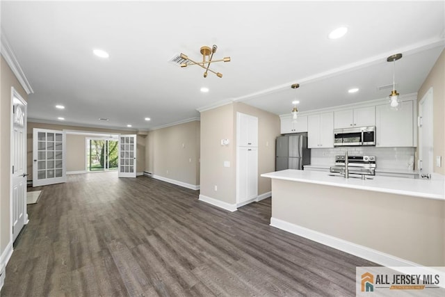 265 Crosse Dr Unit 265A, Monroe, NJ 08831 - kitchen with appliances with stainless steel finishes, open floor plan, ornamental molding, recessed lighting, and light countertops
