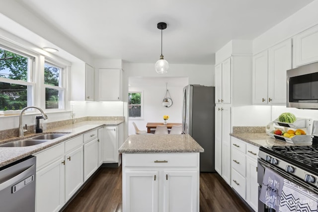 54 Morningside Rd, Colonia, NJ 07067 - kitchen with appliances with stainless steel finishes, a sink, dark wood-style flooring, and white cabinetry