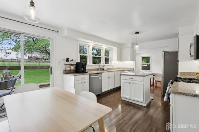 54 Morningside Rd, Colonia, NJ 07067 - kitchen with appliances with stainless steel finishes, a sink, plenty of natural light, and a kitchen island