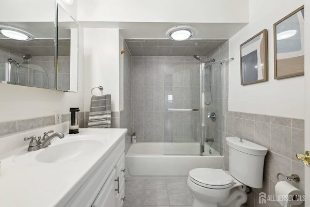 54 Morningside Rd, Colonia, NJ 07067 - bathroom featuring toilet, vanity, tub / shower combination, tile patterned flooring, and tile walls