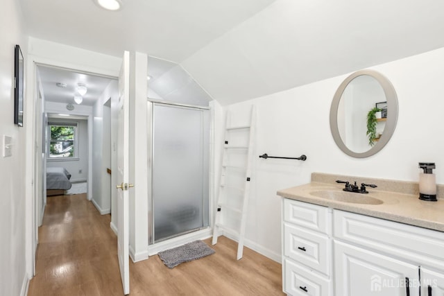 54 Morningside Rd, Colonia, NJ 07067 - full bath featuring a shower stall, vanity, wood finished floors, vaulted ceiling, and connected bathroom