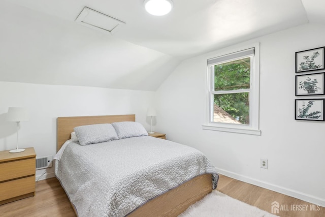 54 Morningside Rd, Colonia, NJ 07067 - bedroom featuring attic access, vaulted ceiling, wood finished floors, and baseboards