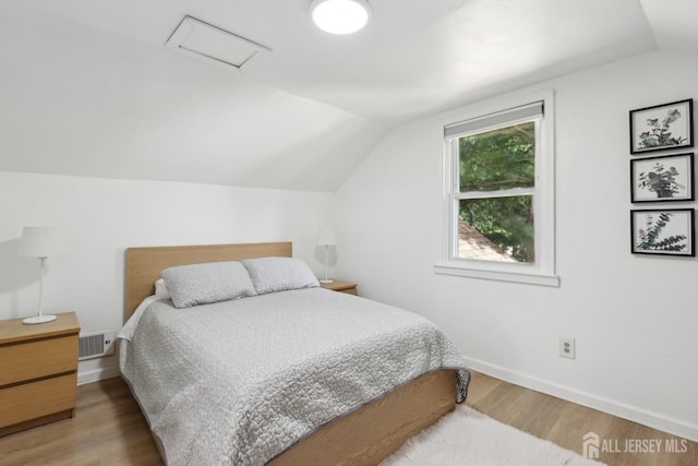 54 Morningside Rd, Colonia, NJ 07067 - bedroom featuring attic access, vaulted ceiling, baseboards, and wood finished floors
