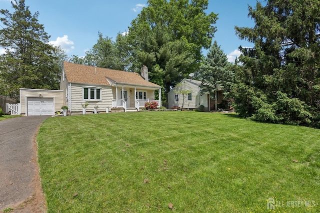 54 Morningside Rd, Colonia, NJ 07067 - view of front of home with covered porch, a chimney, asphalt driveway, a front yard, and an attached garage