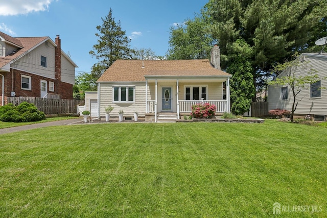 54 Morningside Rd, Colonia, NJ 07067 - view of front of house featuring covered porch, a chimney, a garage, and asphalt driveway