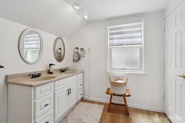 54 Morningside Rd, Colonia, NJ 07067 - bathroom featuring double vanity, wood finished floors, and vaulted ceiling