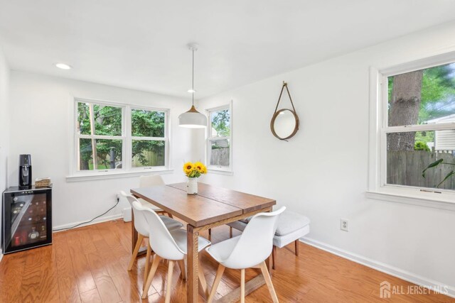 54 Morningside Rd, Colonia, NJ 07067 - dining room featuring wine cooler, light wood-type flooring, baseboards, and recessed lighting