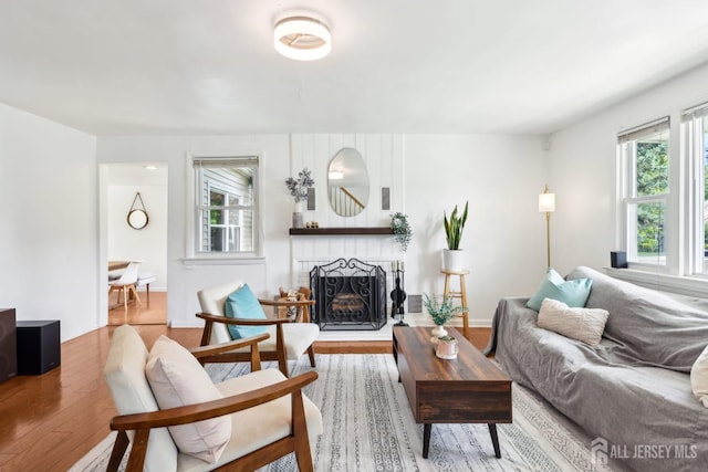 54 Morningside Rd, Colonia, NJ 07067 - living room featuring healthy amount of natural light, wood finished floors, and a fireplace