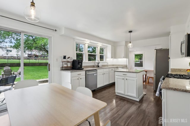 54 Morningside Rd, Colonia, NJ 07067 - kitchen with stainless steel appliances, a sink, a center island, and plenty of natural light