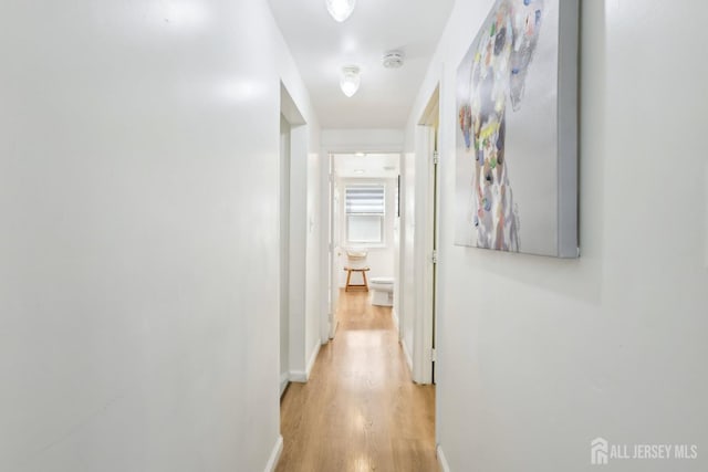 54 Morningside Rd, Colonia, NJ 07067 - hallway featuring light wood-style flooring and baseboards