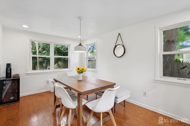 54 Morningside Rd, Colonia, NJ 07067 - dining space featuring baseboards, wood finished floors, wine cooler, and recessed lighting