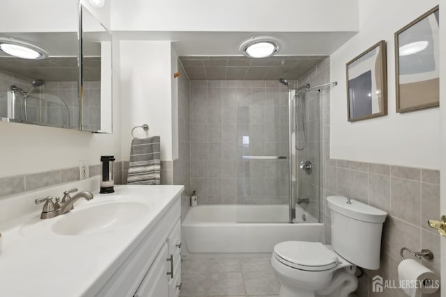 54 Morningside Rd, Colonia, NJ 07067 - full bath with toilet, vanity, tile patterned flooring, washtub / shower combination, and tile walls