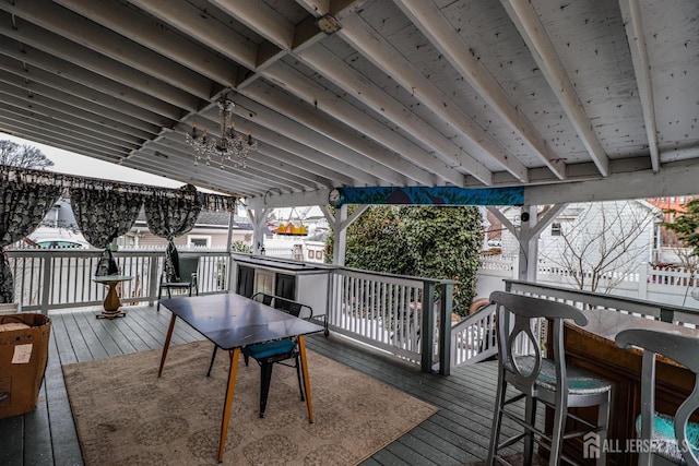 wooden deck with an outdoor bar