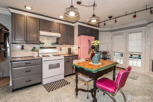 kitchen featuring white appliances, ornamental molding, decorative backsplash, french doors, and under cabinet range hood