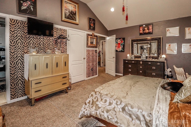 carpeted bedroom with lofted ceiling and baseboards