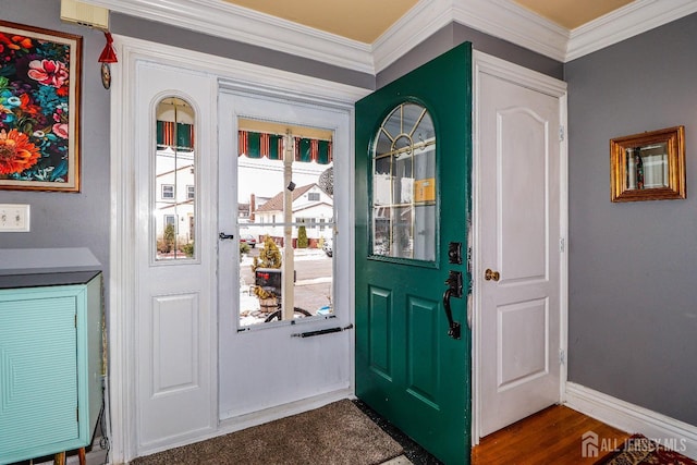 entryway featuring dark wood-style floors, baseboards, and ornamental molding